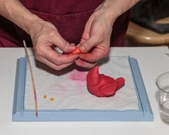 mixing colored clay to form new color
